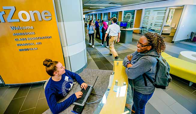 A student being helped at the StarZone front desk